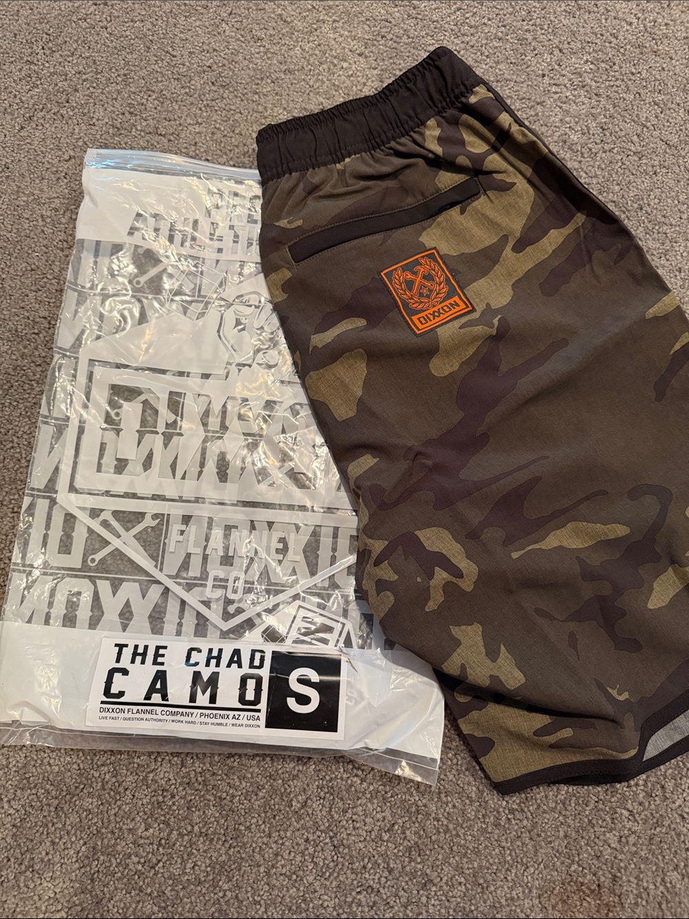 DIXXON Olive Camo Men’s Athletic Shorts with Orange Logo Patch